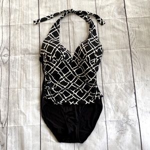 Black and white one piece halter style swimsuit.